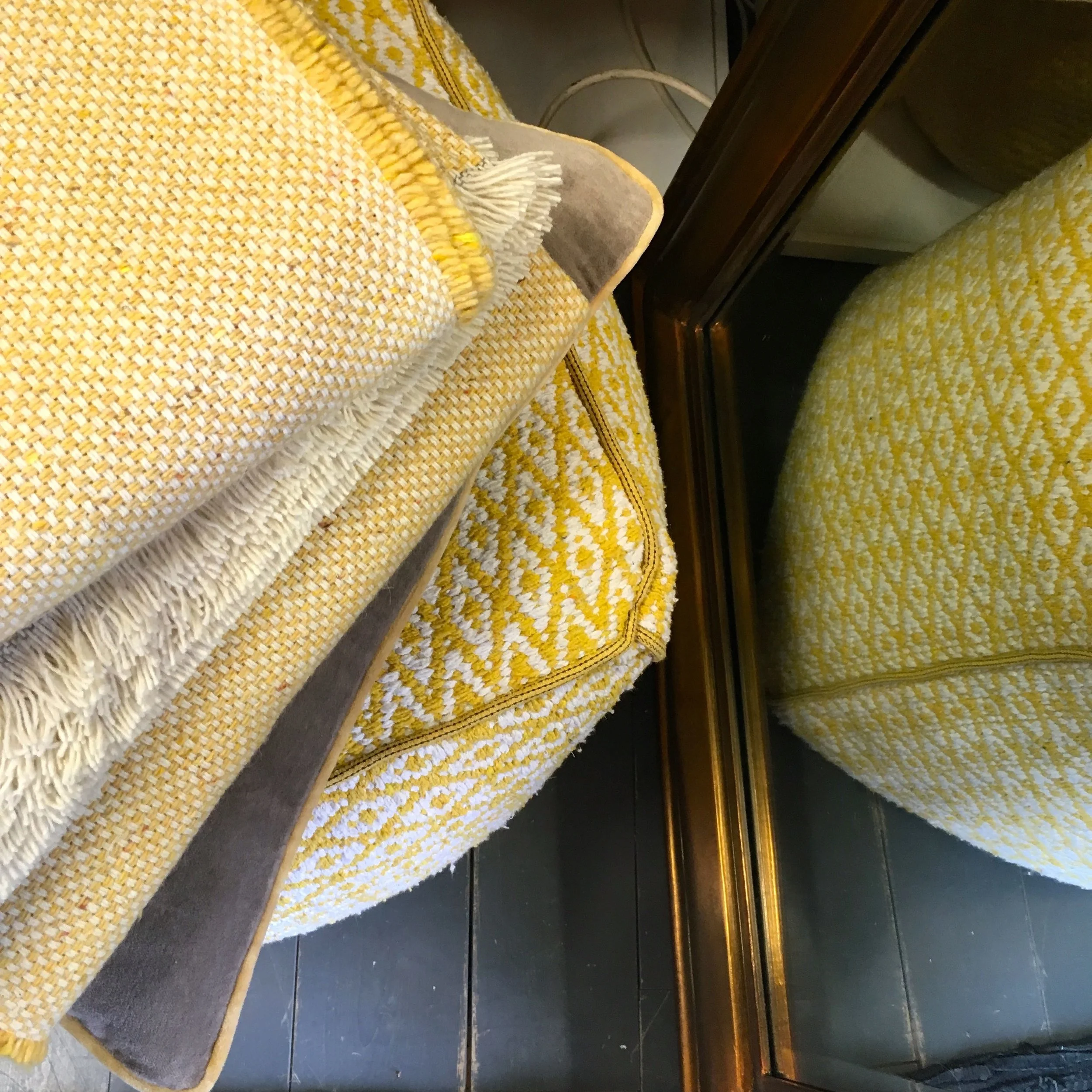 Textured blankets and pouffes