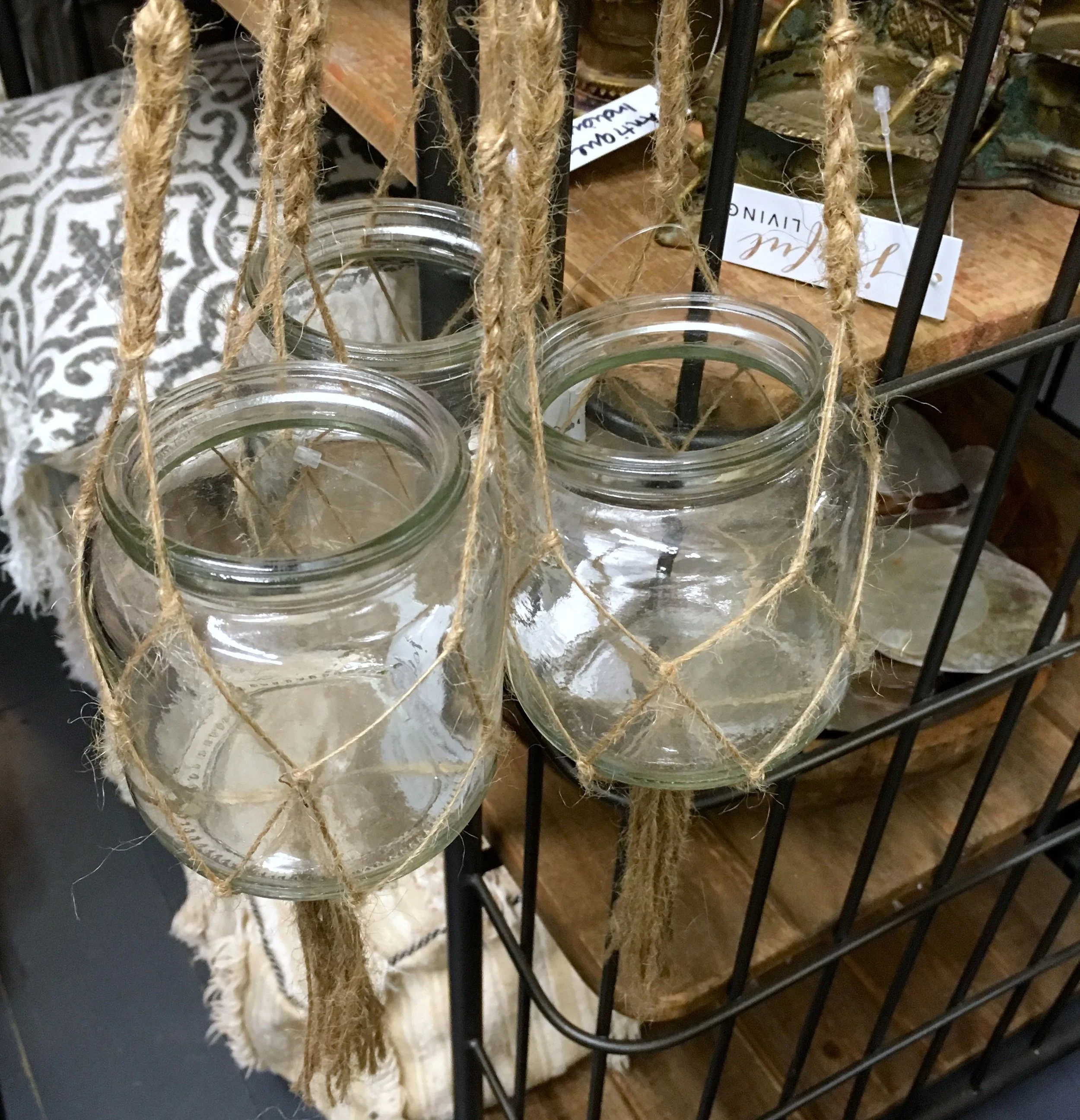 Glass jars hung in twine