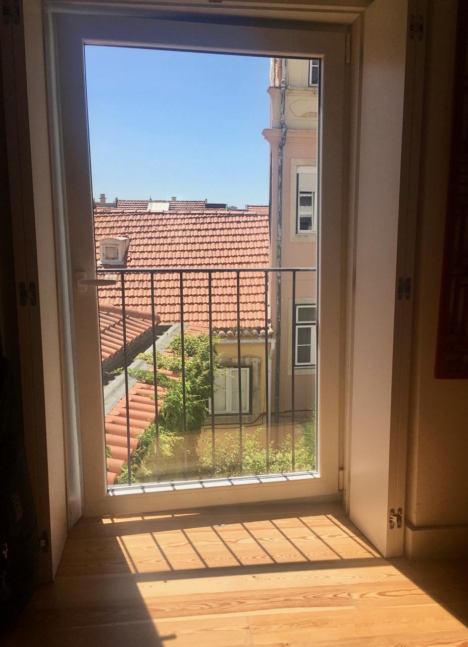 stepping back to get views of the lisbon rooftops