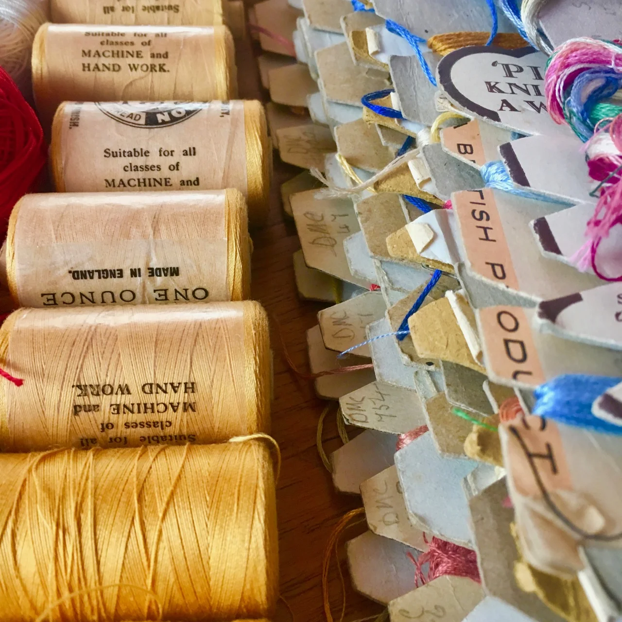 yellow thread and embroidery threads on cards