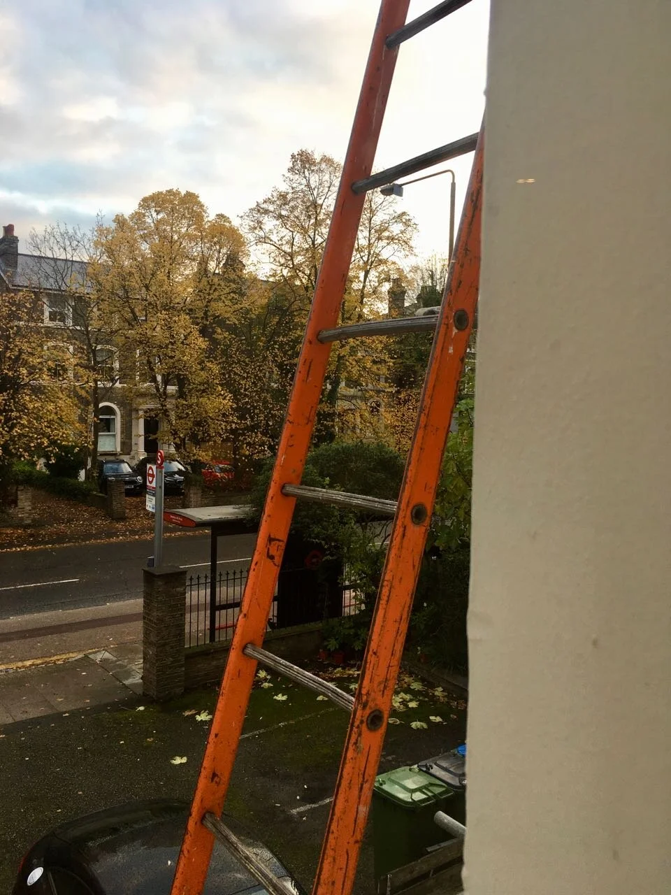 A ladder goes past our bedroom window