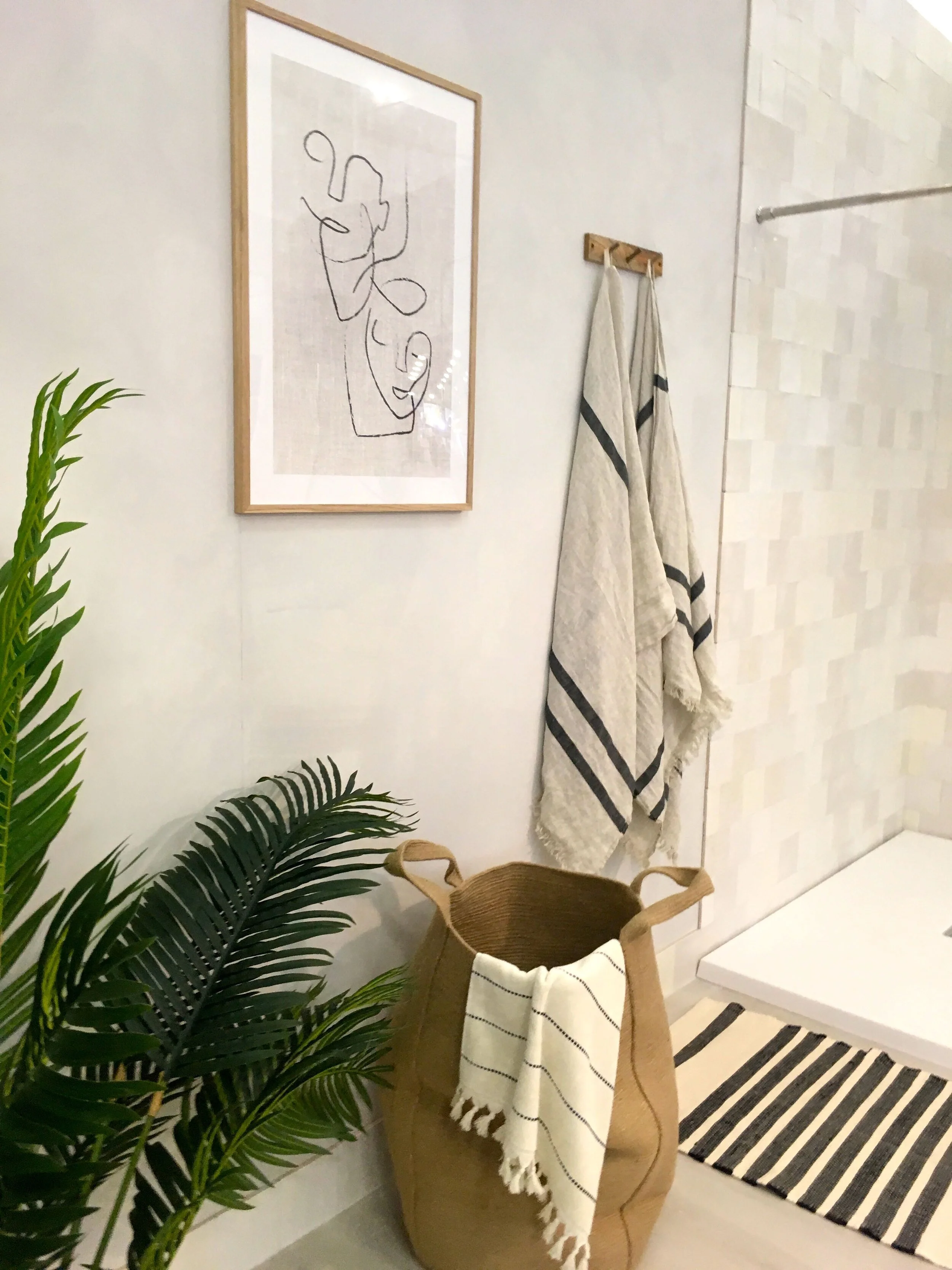 artwork and towel storage that's stylish too
