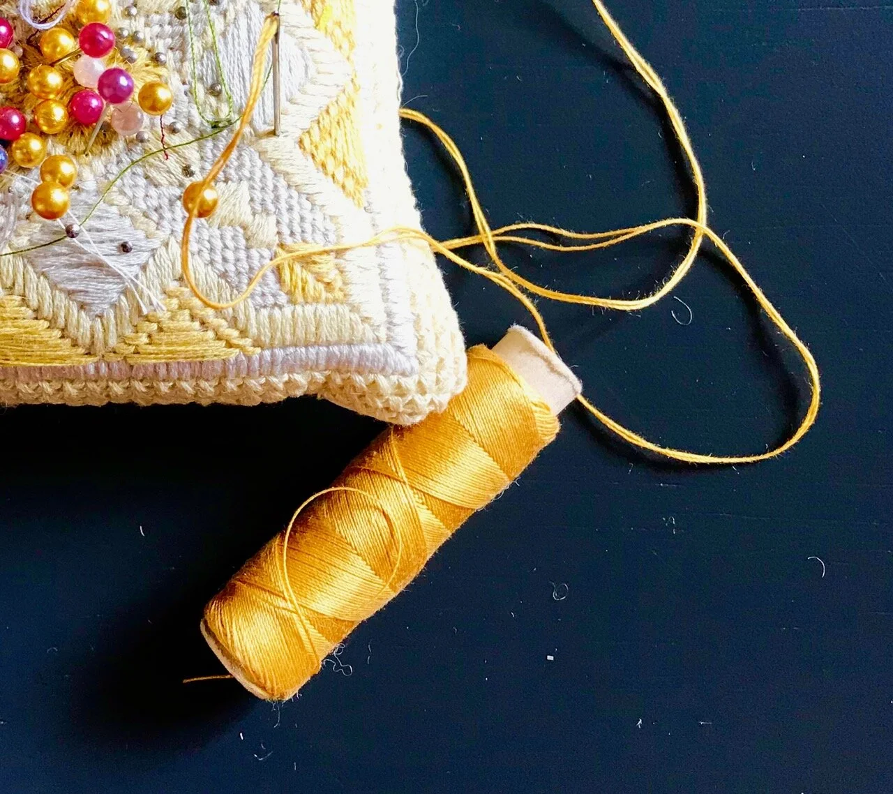 thread and pincushion