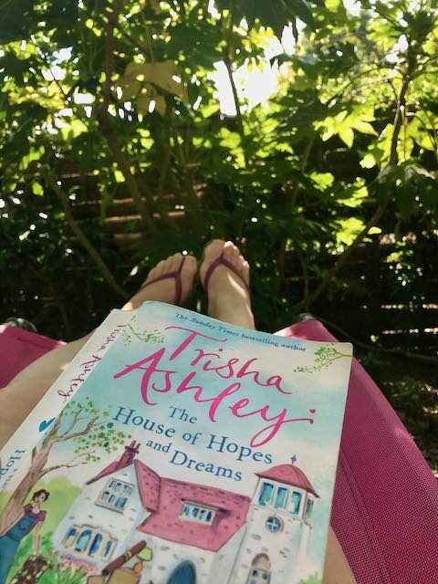 feet up, book out, a sunlounger afternoon