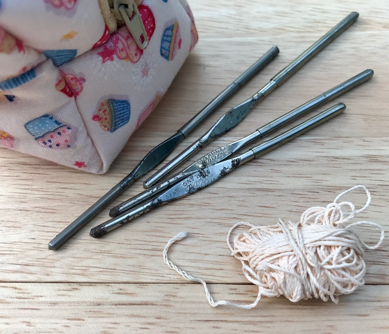 tiny metal hooks and a scrap of thread