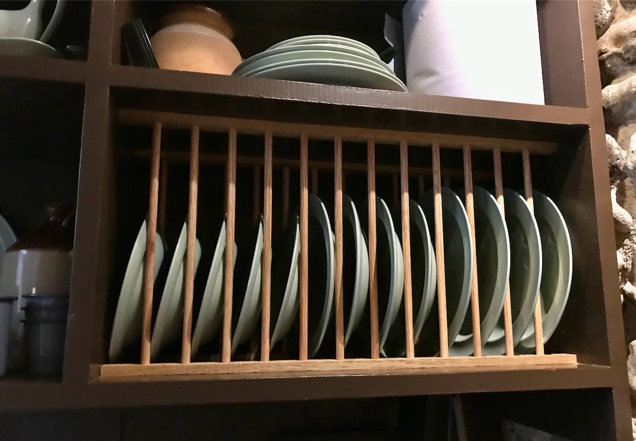 plates above the sink