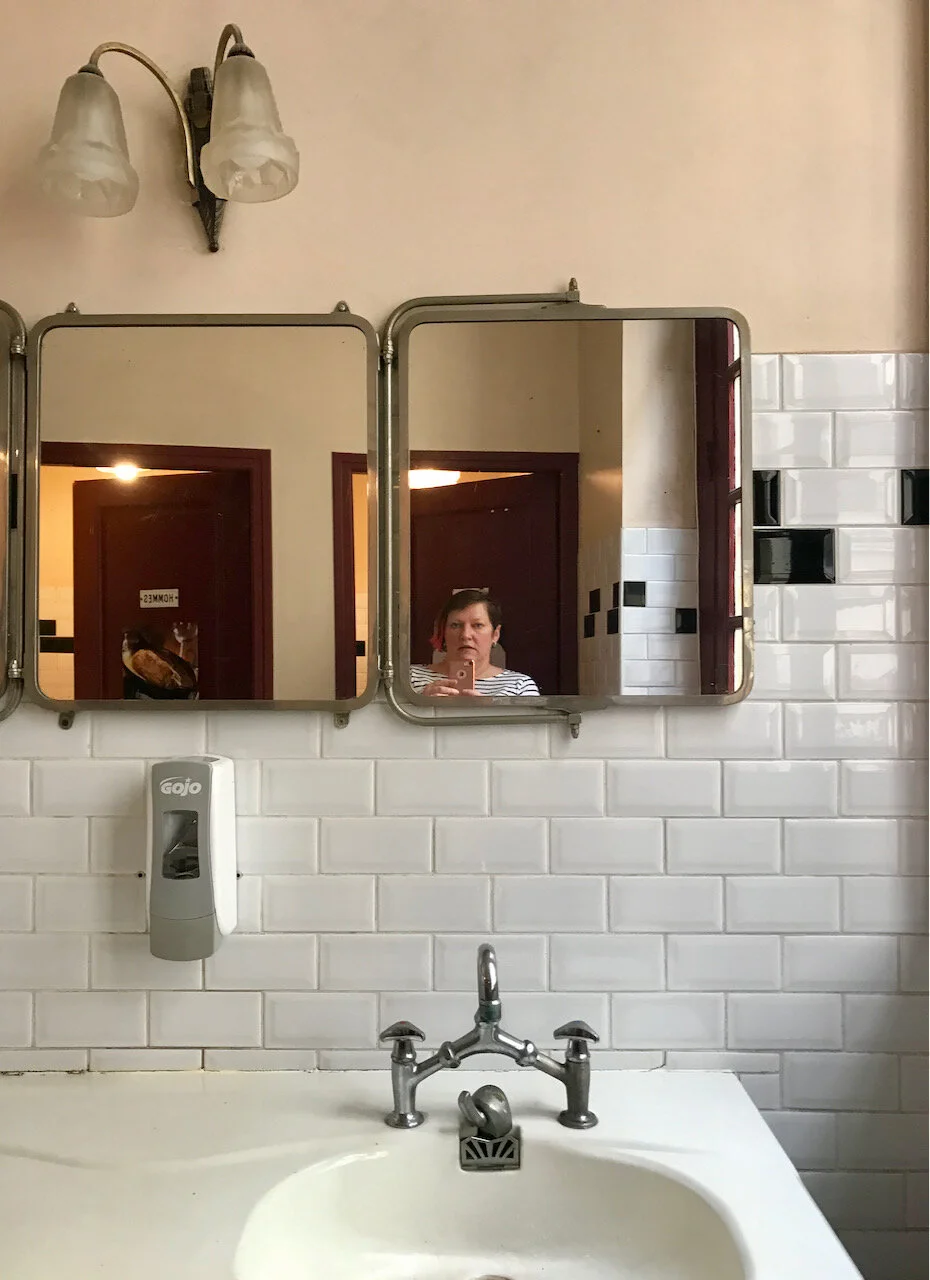 mirrors and white tiles