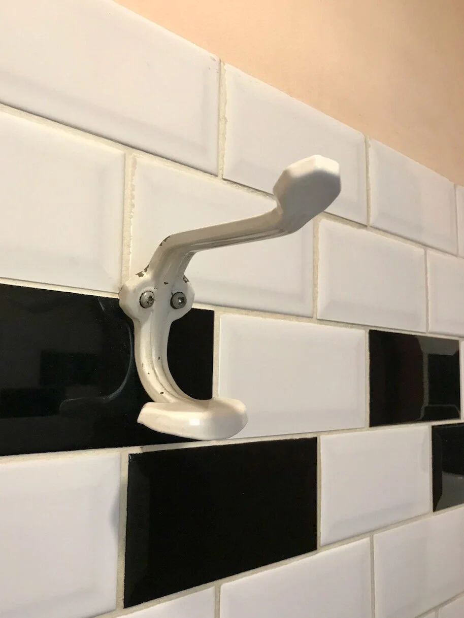 vintage+coat+hook+on+black+and+white+tiles