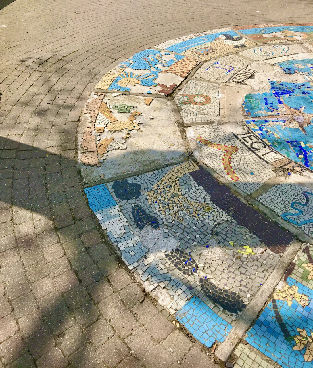 a broken mosaic on the thames path.jpeg