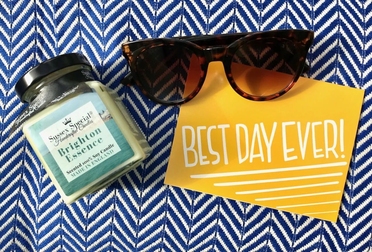 Brighton Essence candle, sunglasses and best day ever postcard.jpeg