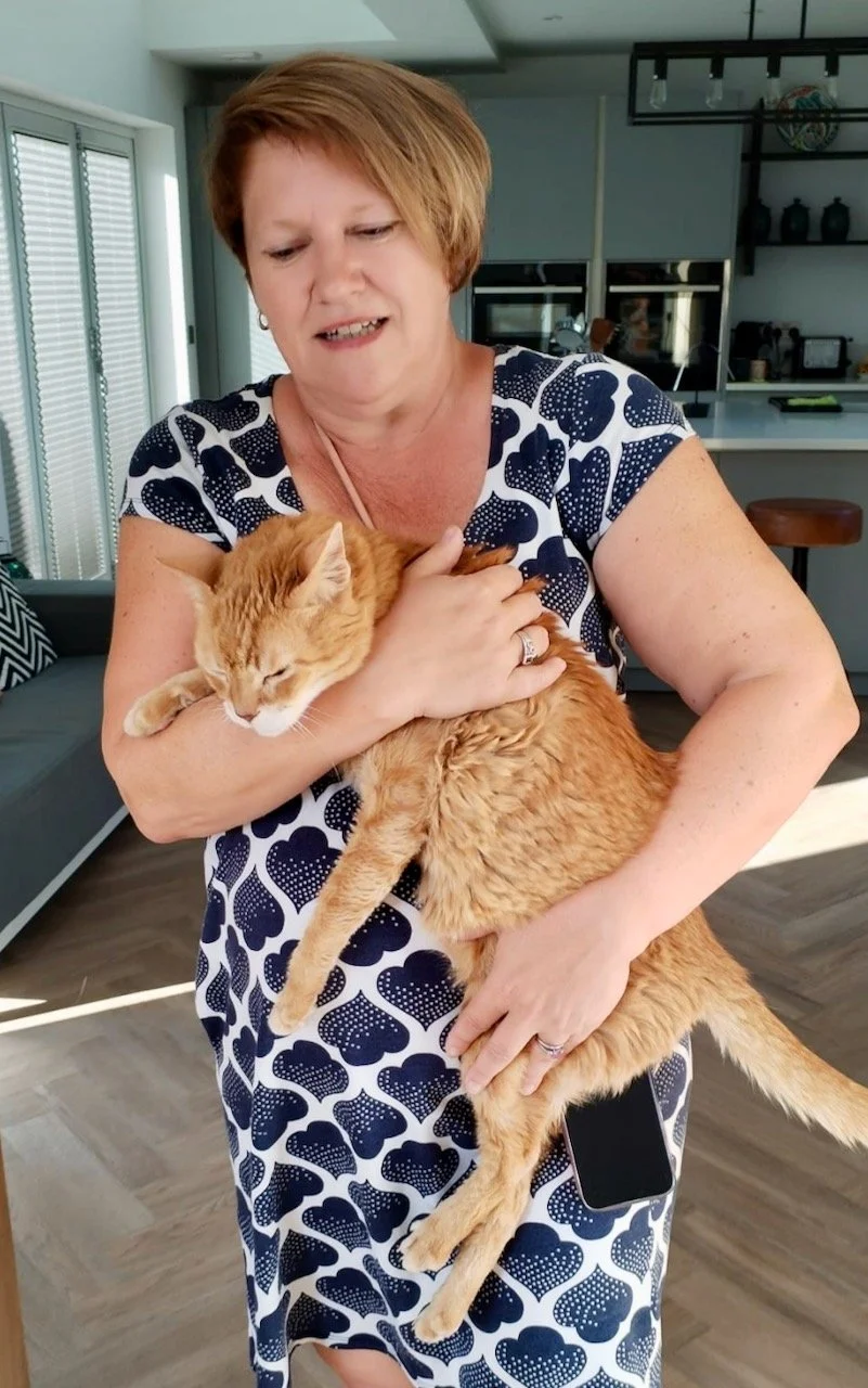 Me holding our ginger tom visitor - carrying him to the door!