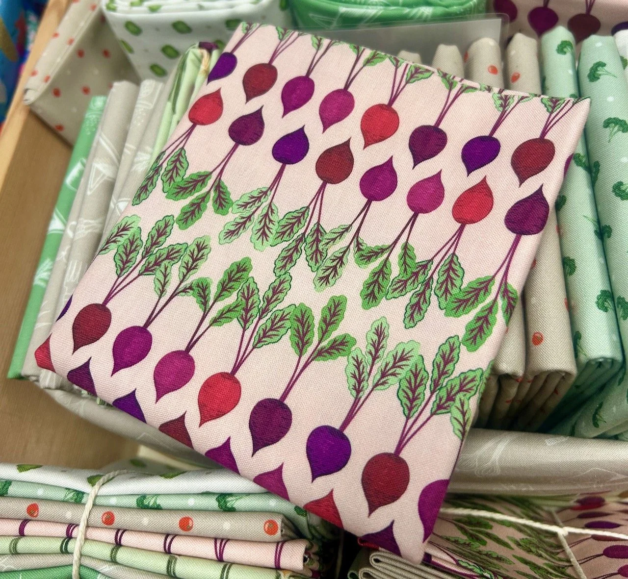A fat quarter of fabric printed with a cute beetroot design