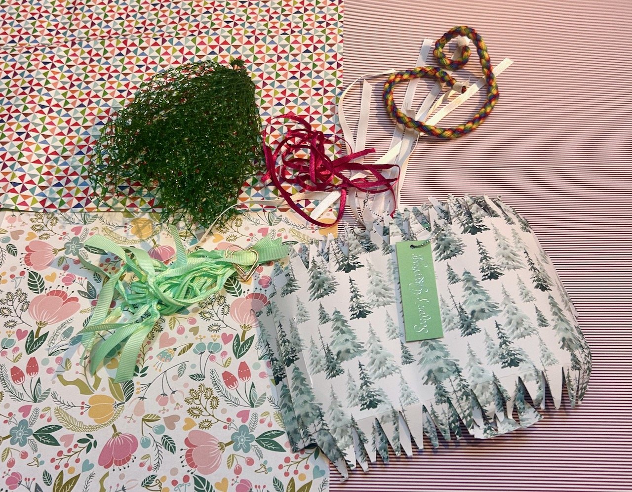 A lime fruit net, various ribbons and ties - plus scavenged cracker parts