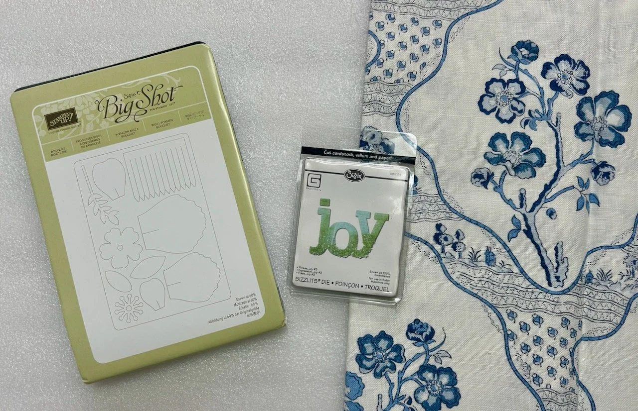 A couple of sizzix dies an blue and white linen fabric remnant