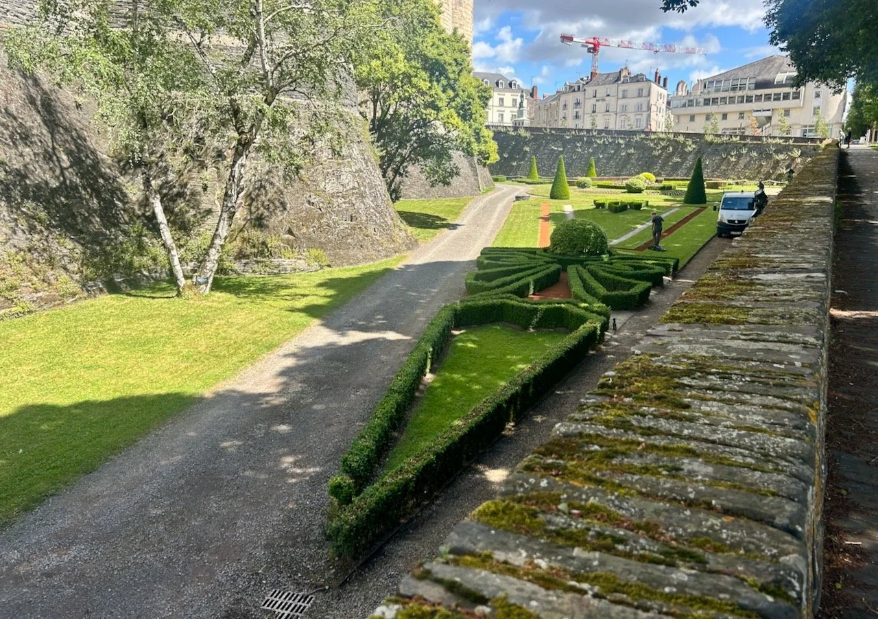 The formal and ornate gardens in the castle's former moat