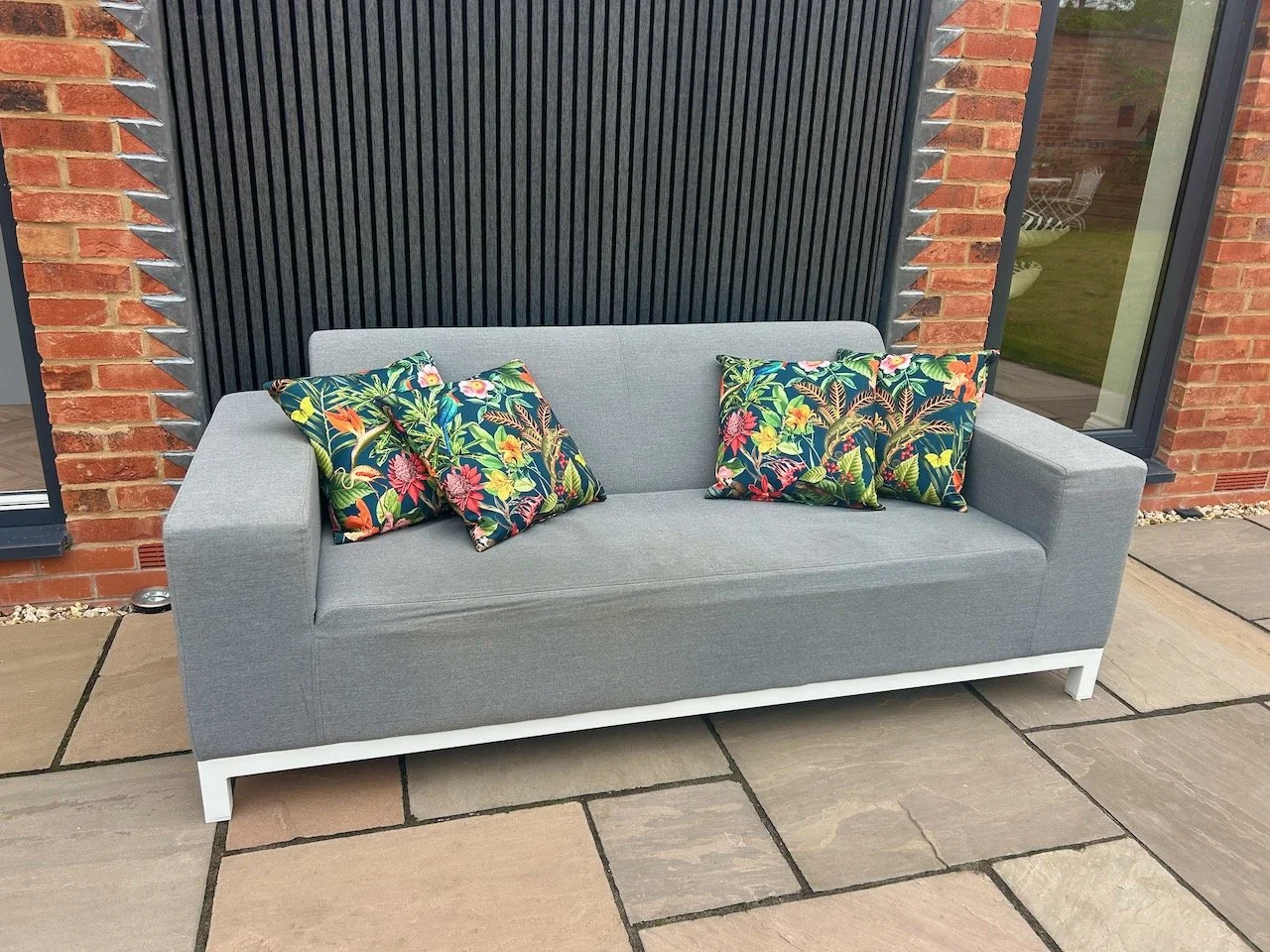 The garden sofa, outside for the first time ever - along with tropical outdoor cushions