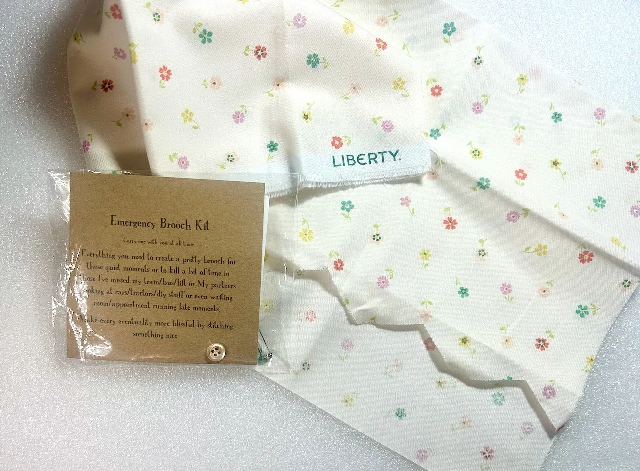 A Liberty fabric remnant and an 'emergency brooch kit'