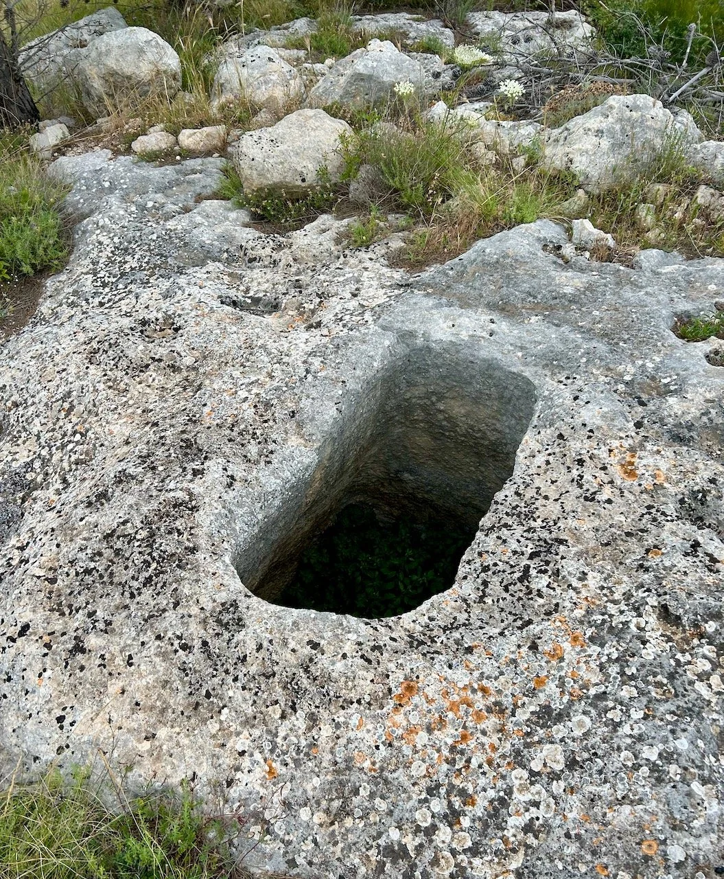 An oblong hole in the rocks on the headland