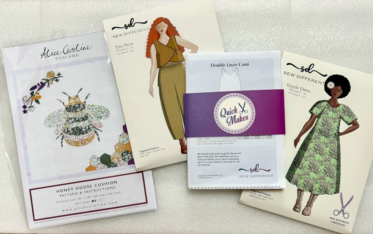 paper patterns for a bee, trousers, a top and a dress