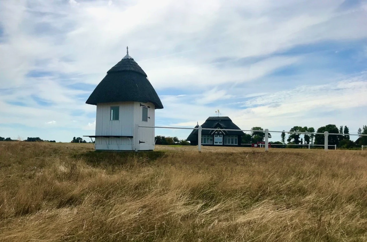 Thatched buildings on the golf course grounds