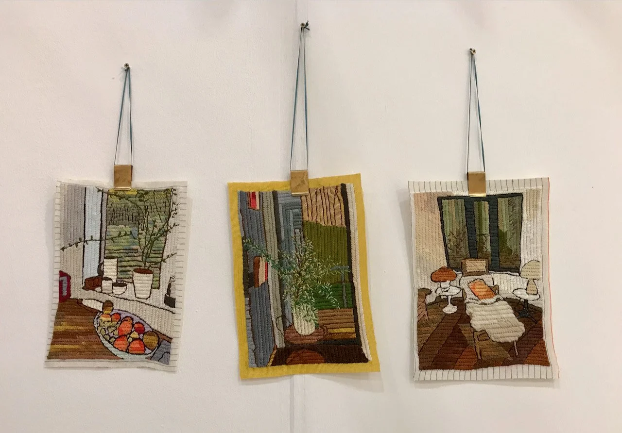 three embroidered room scenes