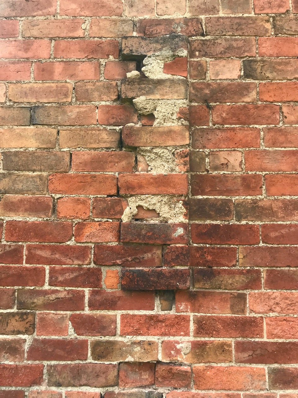 A section of the wall which appears to have a section removed