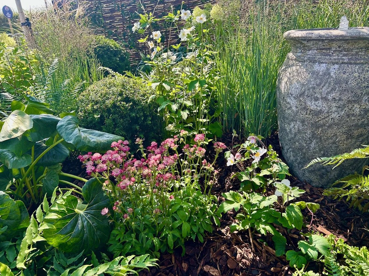 Gates show garden mixing pots in the planting