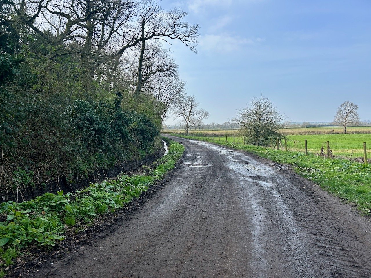 A wetter than expected track bending around to the left with fields on the right