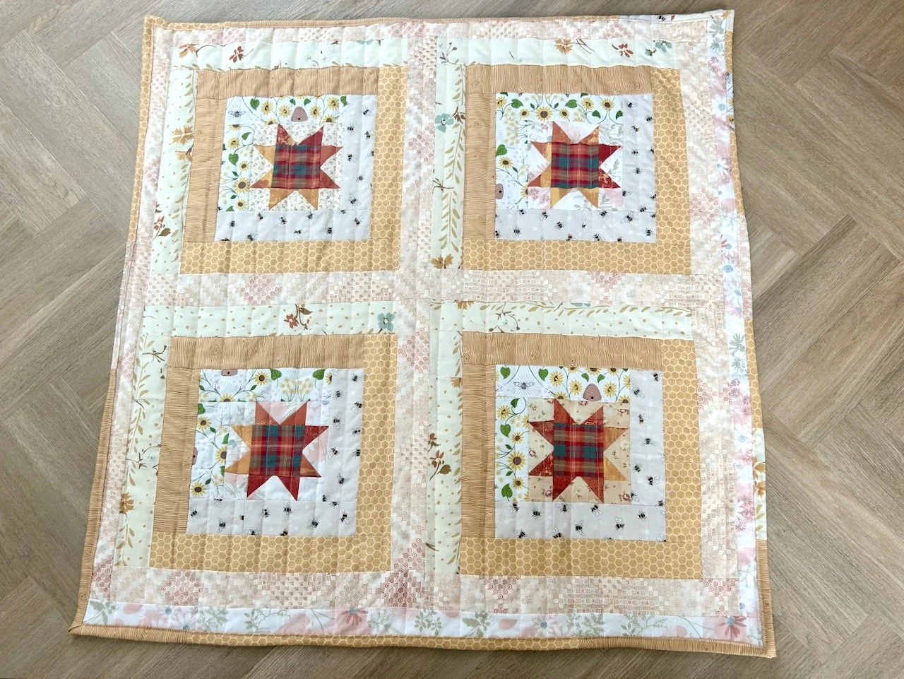 The finished - quilted and bound - friendly bee quilt