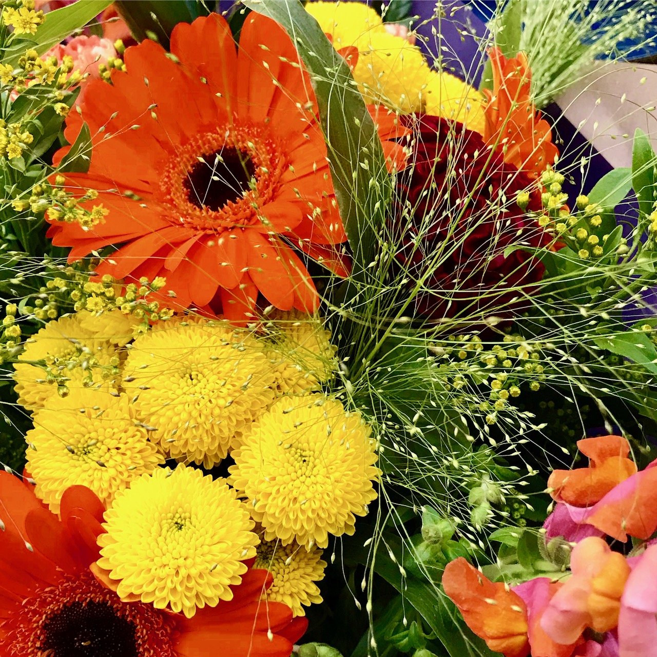 Orange gerberas, yellow dahlias and spray 'fillers' - part of the flowers that MOH bought for our wedding anniversary - he's a keeper!