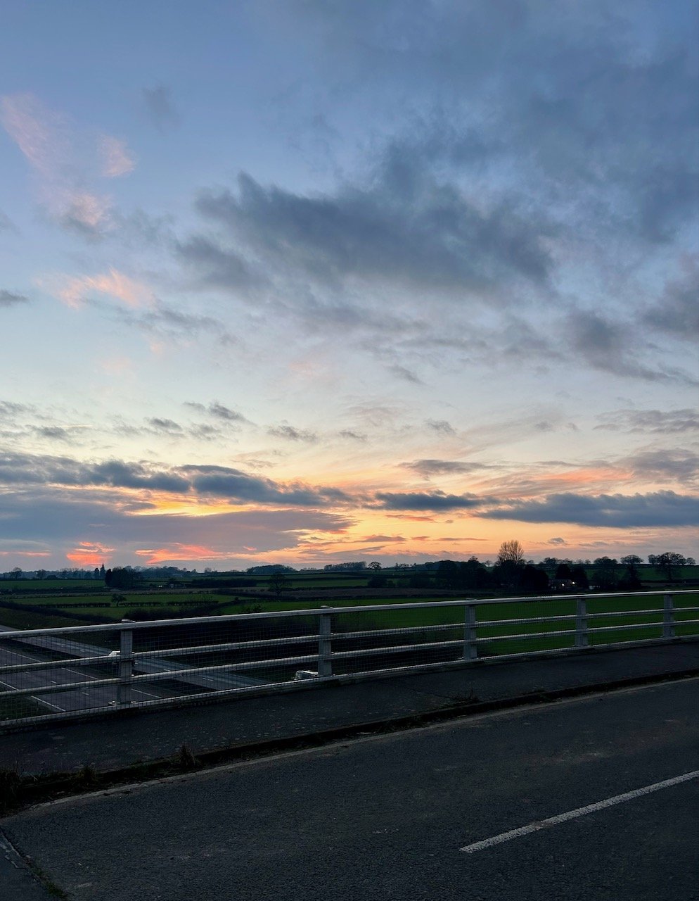 On the bridge over the A46 again looking towards the sunset with dramatic clouds