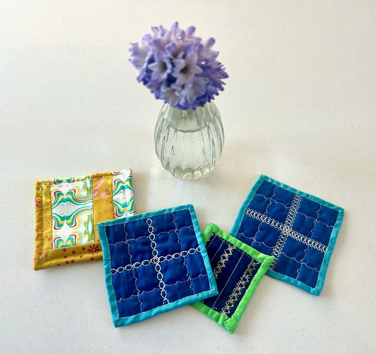 The reverse of the mats and the pouch - with one of my hyacinths in a vase