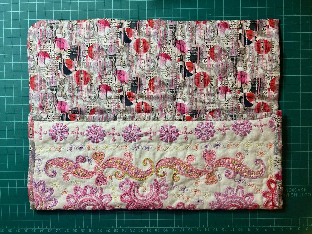 The foldover top opened out to show the text patterned lining