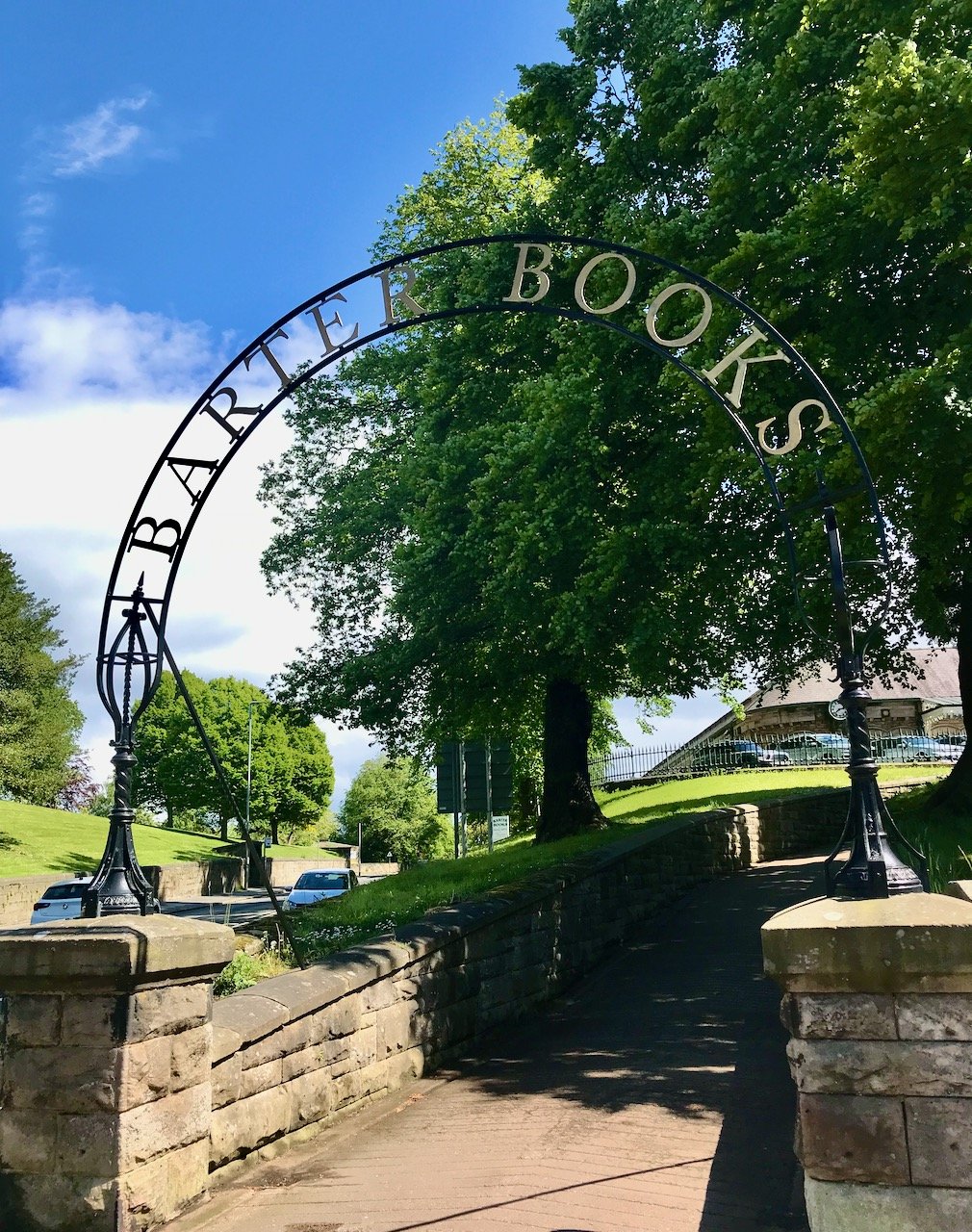 Barter Books sign arching above stone steps at the entrance