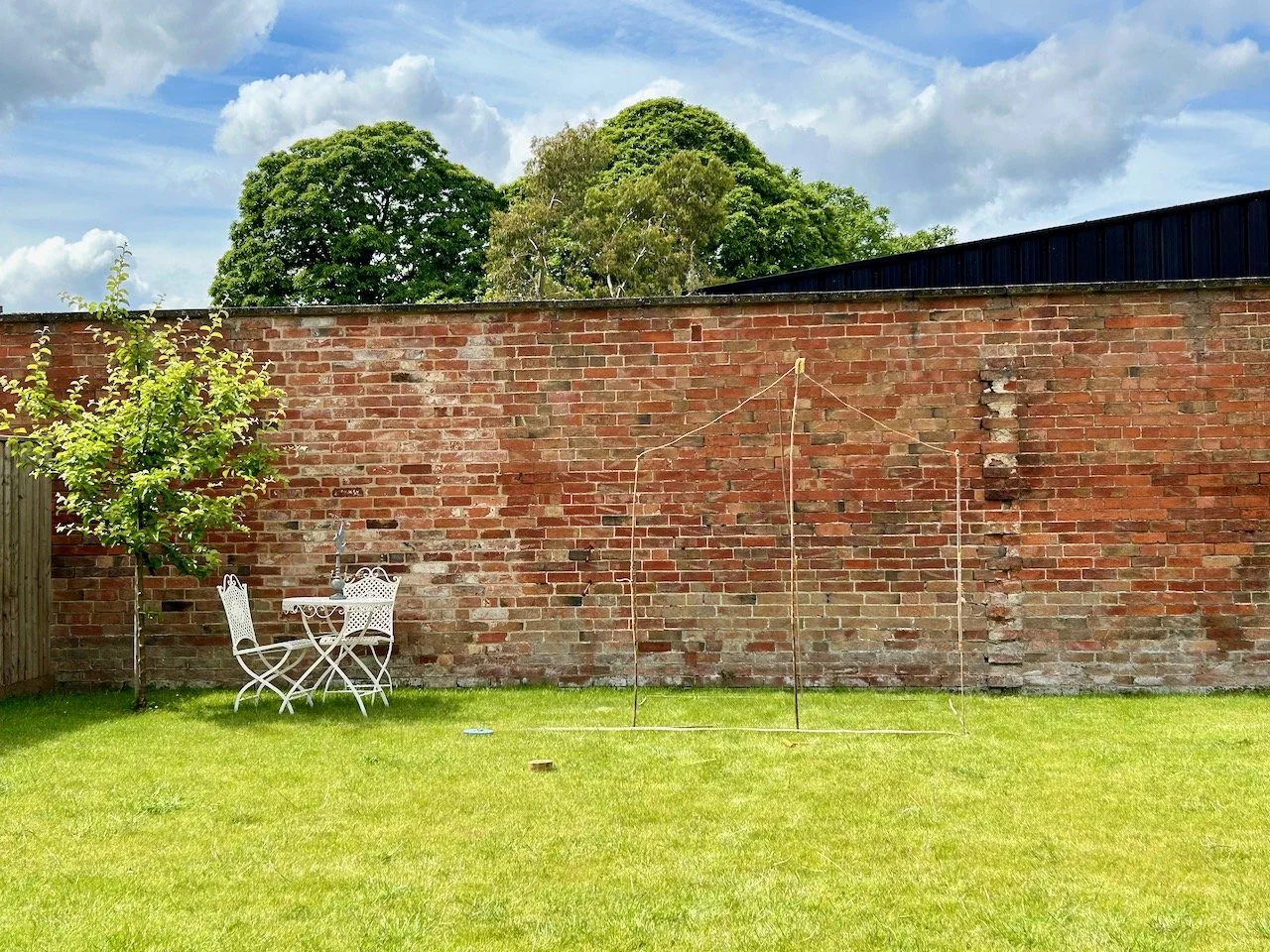 Mocking up a greenhouse with string and bamboo canes