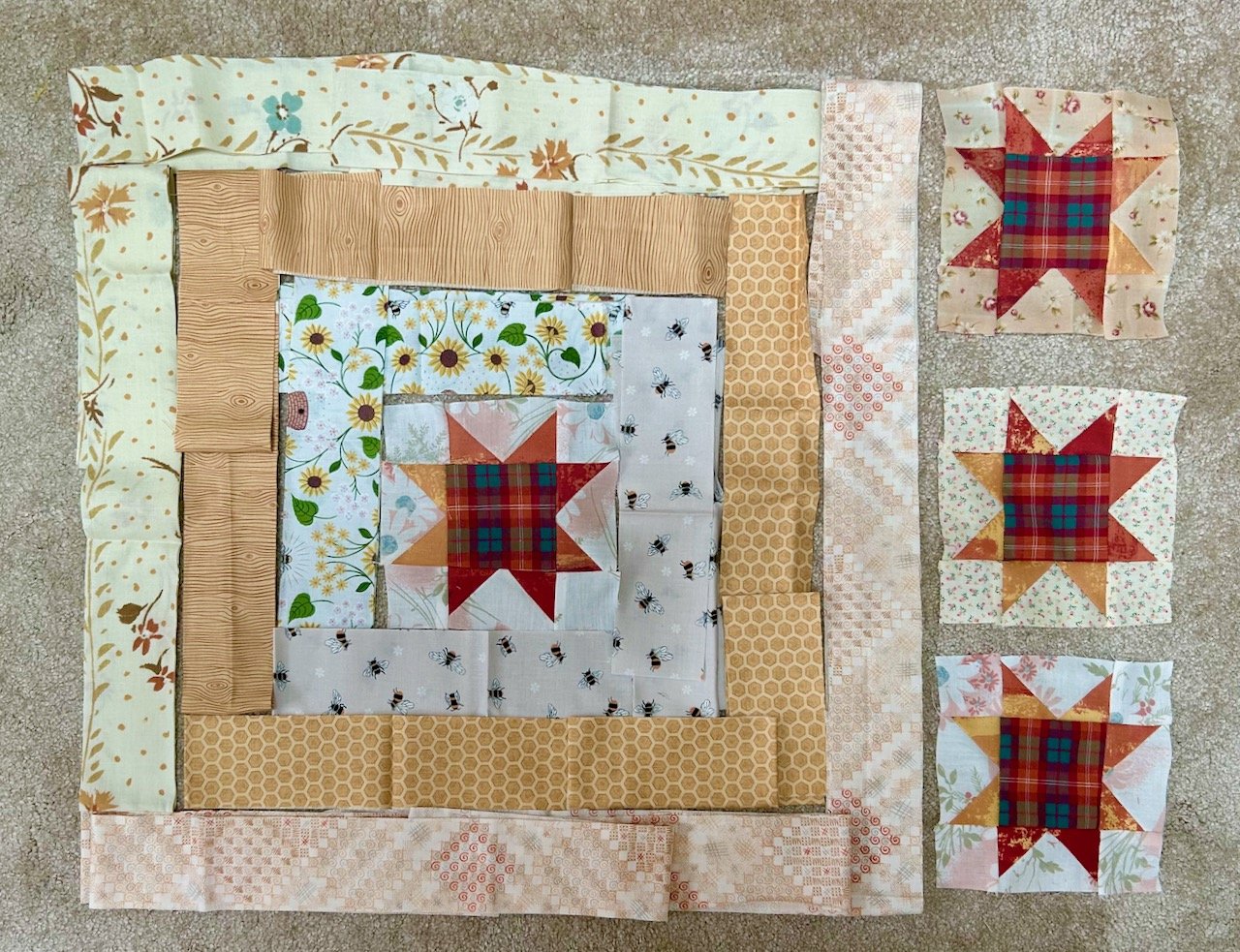 Laying out the border fabric - with two bee fabrics - to see how they work together