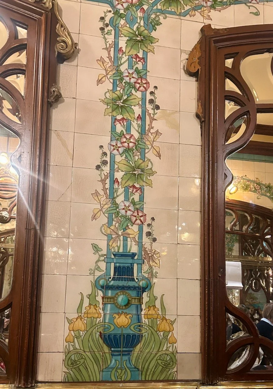 The art deco tiles and carved wooden mirrors