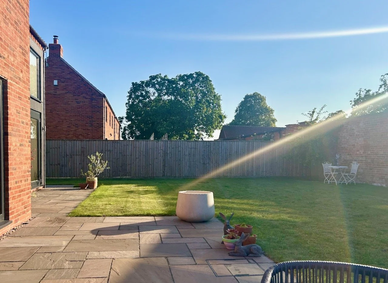 checking the new large pot is in the perfect position on the patio