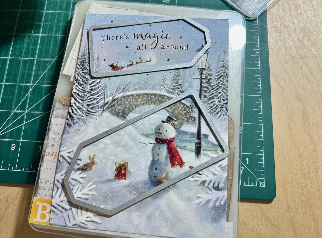 Using the die cutters to pick which parts of the card to use