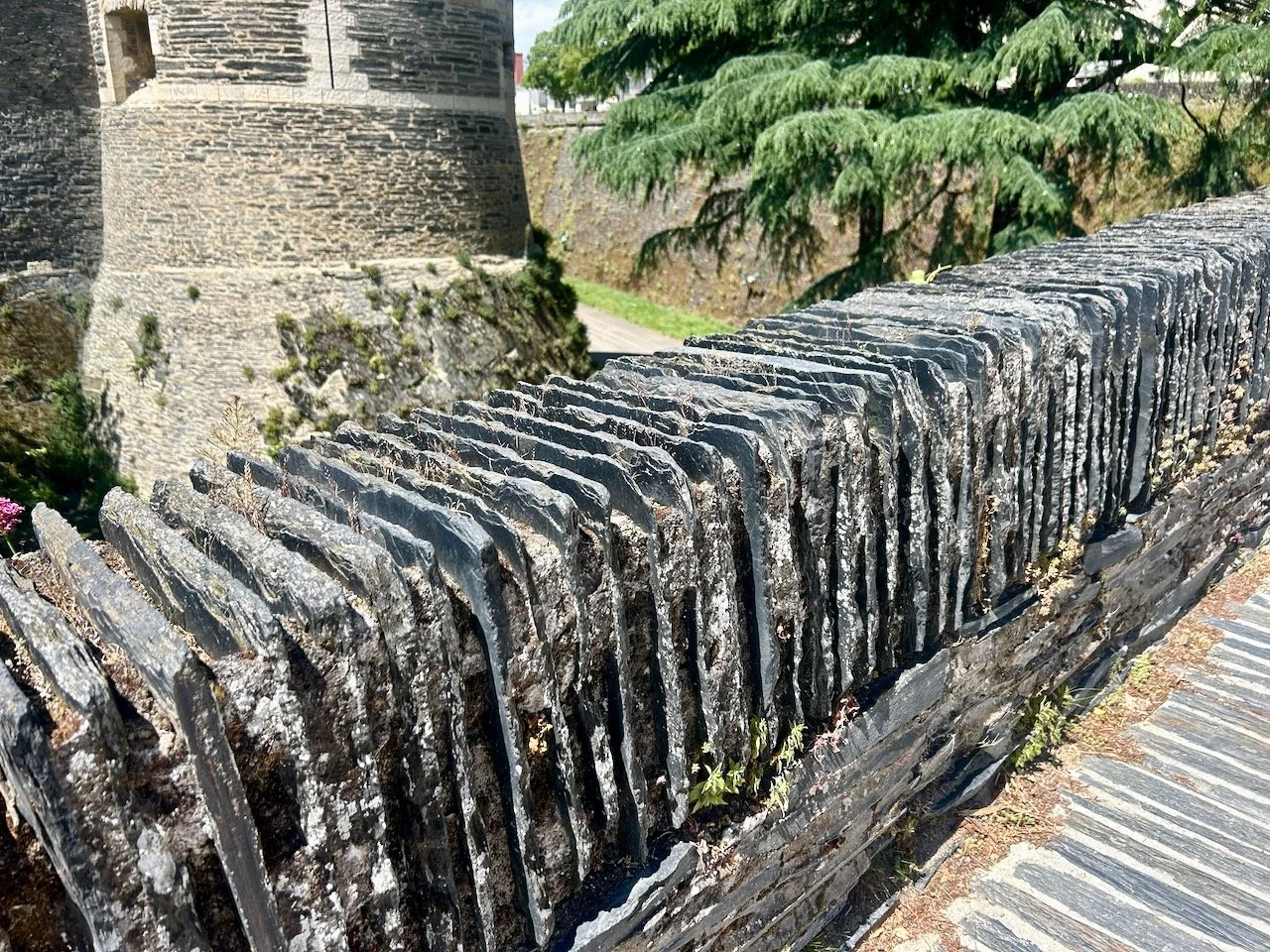 A closeup of the slate edged wall which surrounds the castle in Angers