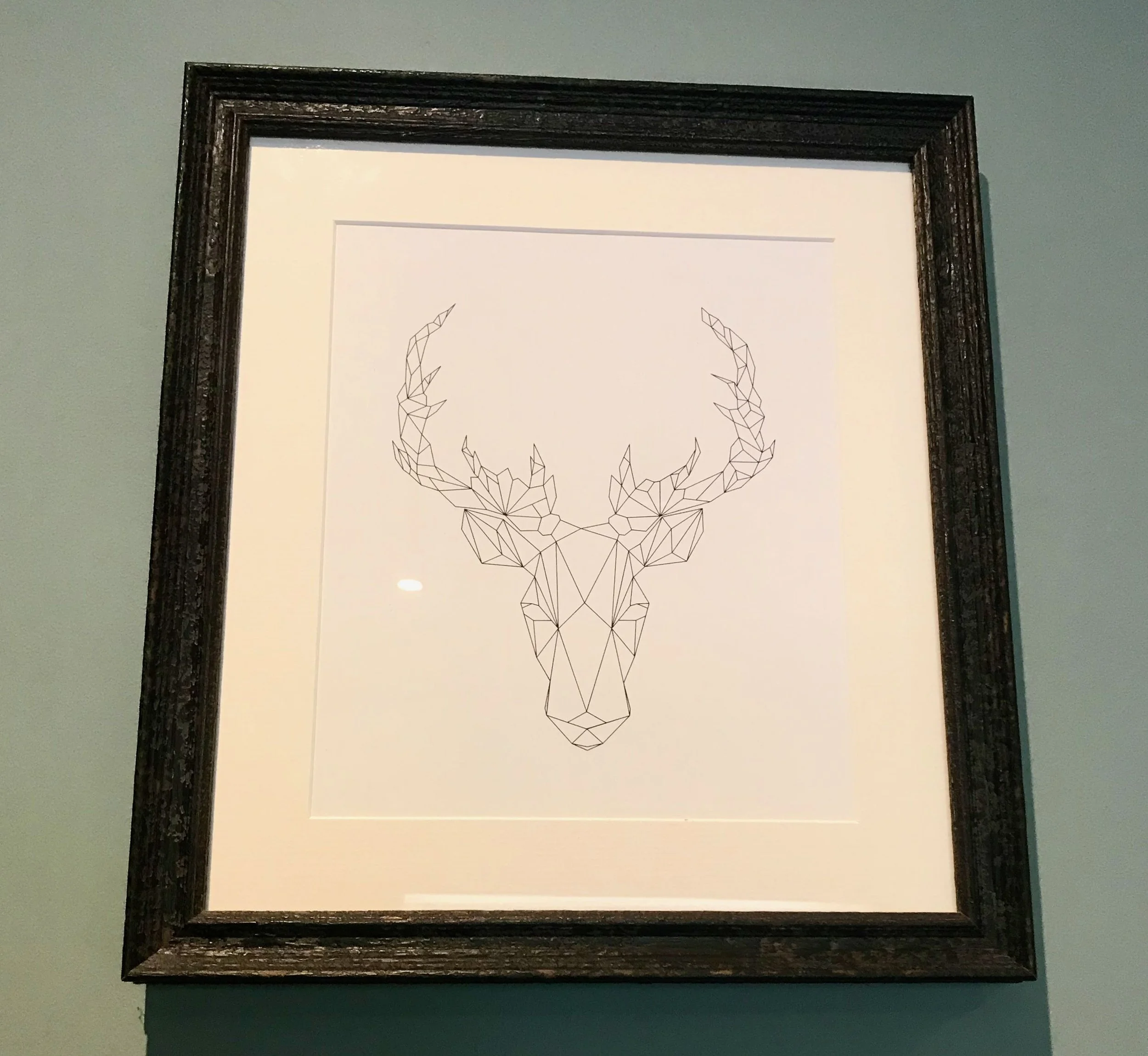 Artwork - a prismatic / geometric representation of a white buck's head