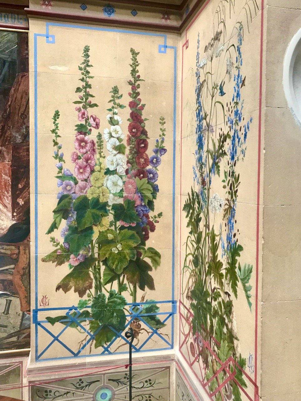 Two of the hand painted panels in the central hall - showing a group of hollyhocks on one and (unknown) blue flowers on the other