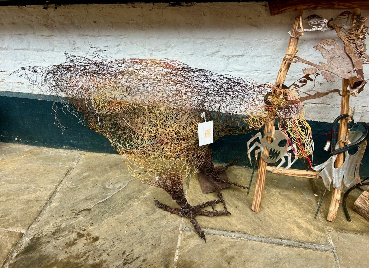 A chicken made of chicken wire, with colour adding interest