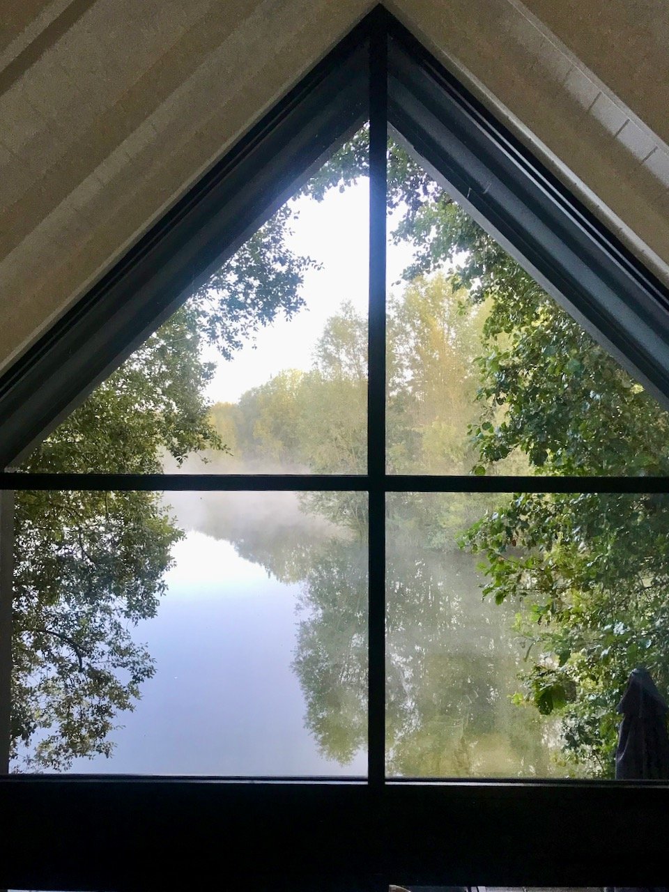 the view of the lake with the mist rolling past the following morning  - so beautiful