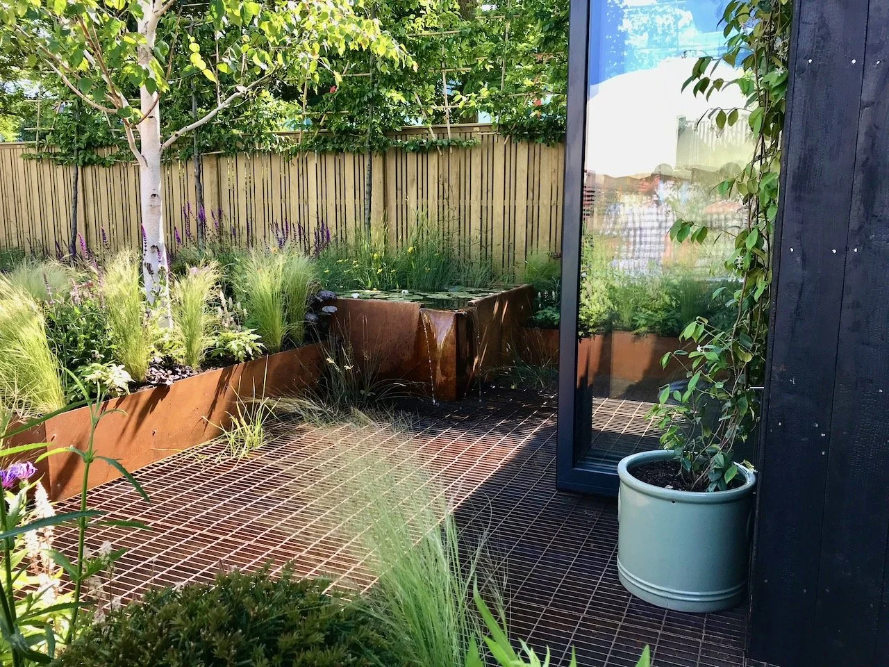 The seating area with pond beneath in the show garden - SubAqua designed by Joshua Fenton