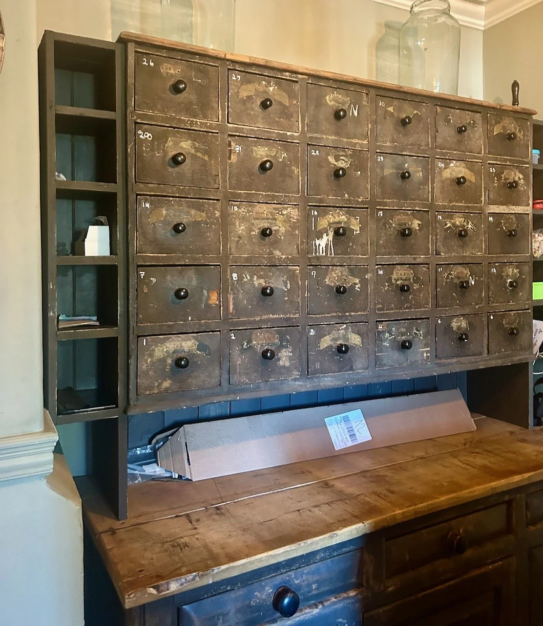 A vintage multi-drawer cabinet with 30 small drawers