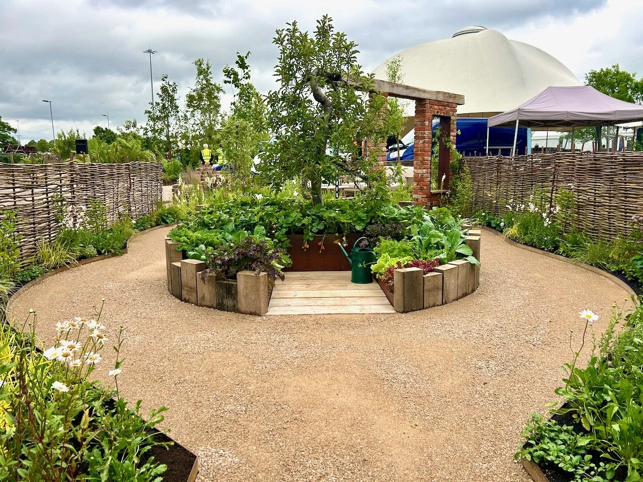 The path meanders around the central feature of the garden