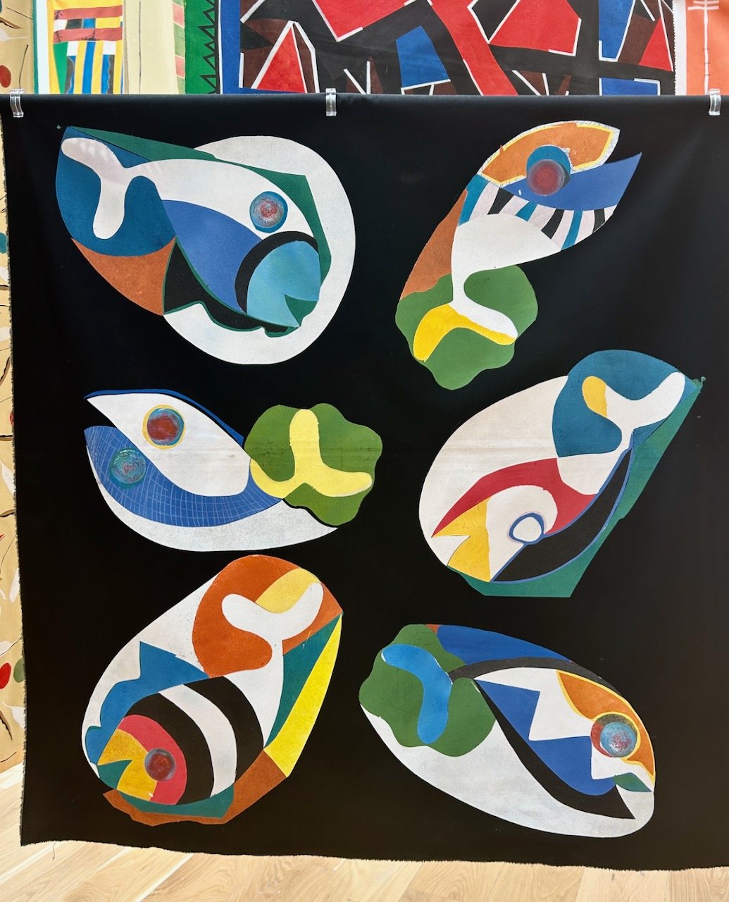 colourful whales - or fishes - on a black background