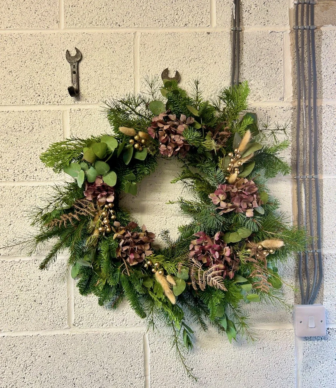 Hanging the wreath in the garage - ahead of storm darragh
