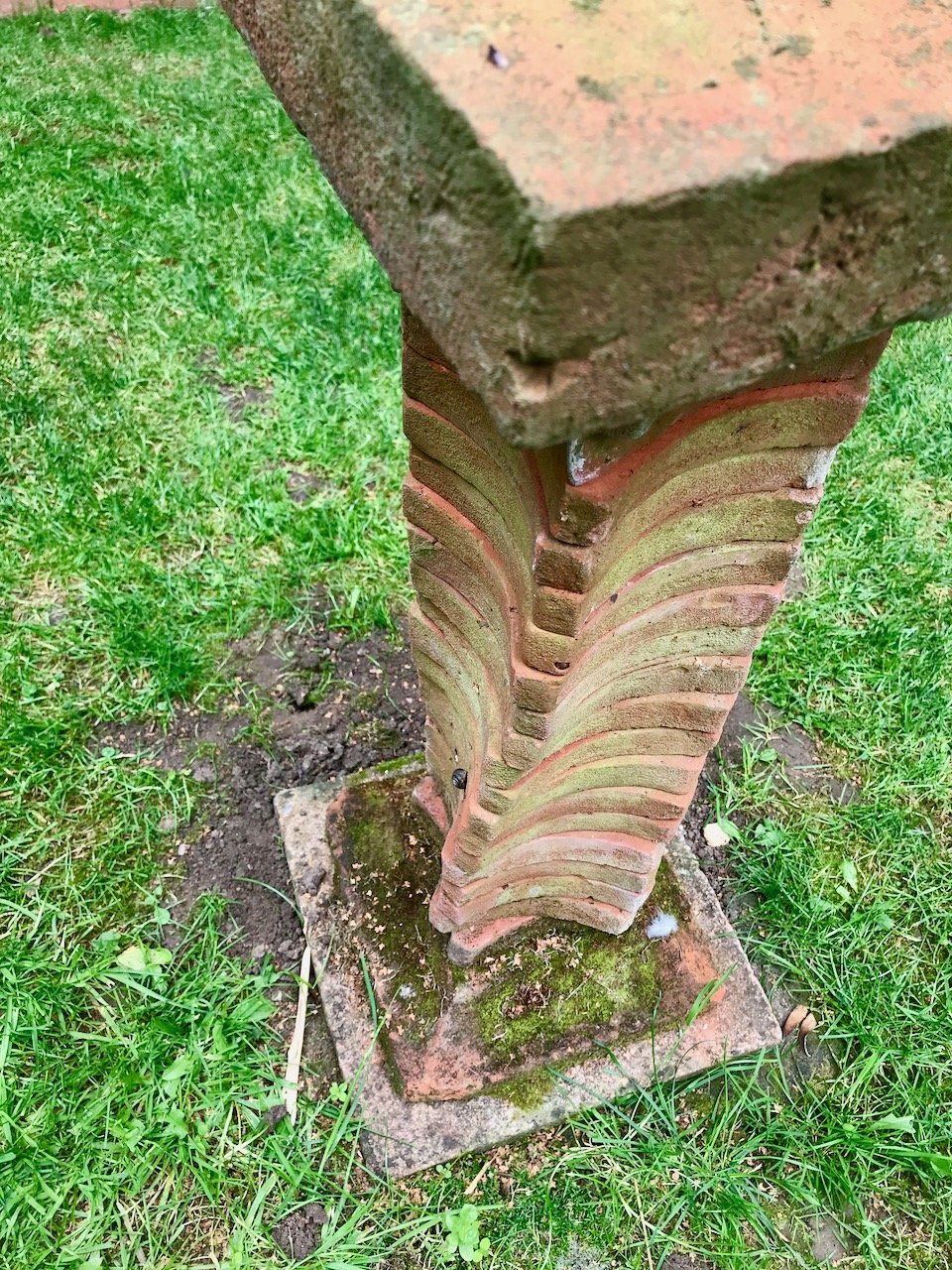 A close up of the twisted stack of the birdbath